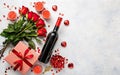 Valentine day romantic background, Valentine's day greeting card with red roses, gift box and wine bottle on white background, To Royalty Free Stock Photo