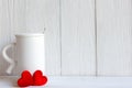 Valentine Day with white cup coffee red heart on the cup, wood white background Royalty Free Stock Photo