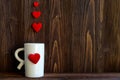 Valentine Day with white cup coffee Sewed pillow hearts row border, old wood background, Royalty Free Stock Photo