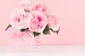 Valentine days background - elegant pastel pink roses bouquet and decorative heart with ribbon on white wood board, copy space. Royalty Free Stock Photo