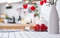 Valentine decor on table of white kitchen in cozy home. Copy space. Gift for valentines day, family love nest. A vase with a