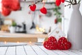 Valentine decor on table of white kitchen in cozy home. Copy space. Gift for valentines day, family love nest. A vase with a