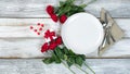 Valentine dinner setting with flowers and gift on white table