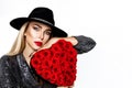 Valentine elegant girl with red heart isolated on white background. Beautiful Happy Young woman with heart of roses. Holiday party