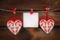 Valentine felt hearts and card on wooden background