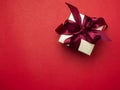 Valentine festival , New year Gold gift box with red ribbon. Red Royalty Free Stock Photo