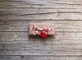 Valentine gift box and heart shape tag on wooden board Royalty Free Stock Photo