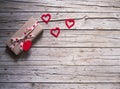 Valentine gift box and heart shape tag on wooden board Royalty Free Stock Photo