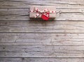 Valentine gift box and heart tag on wooden board Royalty Free Stock Photo