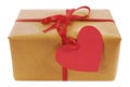 Valentine gift, brown paper parcel, red heart shape gift tag Royalty Free Stock Photo