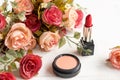 Valentine Gift. Makeup cosmetics tools background and beauty cosmetics, products and facial cosmetics package lipstick with flower Royalty Free Stock Photo