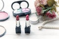 Valentine Gift. Makeup cosmetics tools background and beauty cosmetics, products and facial cosmetics package lipstick with pink r Royalty Free Stock Photo