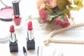 Valentine Gift. Makeup cosmetics tools background and beauty cosmetics, products and facial cosmetics package lipstick with pink r Royalty Free Stock Photo