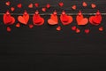 Valentine day background, paper hearts border on wood, copy space Royalty Free Stock Photo
