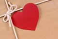 Valentine gift, red heart shape gift tag, brown paper packag Royalty Free Stock Photo