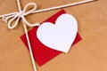 Valentine gift, white heart card, red envelope, brown paper