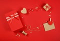 Valentine gifts and card on red wrapping paper