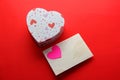 Valentine gifts letters, flowers and chocolates with hearts on red background