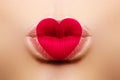 Valentine Heart on beautiful female Lips. Sweet Kiss. Love Makeup for Valntines Day. Shape Heart like Symbol of Love