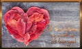 Valentine with a heart of red autumn leaves that lie on the shabby retro gray table with a Declaration of love