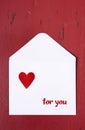 Valentine letter envelope on red background. Royalty Free Stock Photo