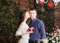 Man makes gift, box for his girlfriend. Valentine, love and relationship. tenderness