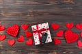 Valentine or other holiday handmade present in paper with red hearts, car keys and gifts box in holiday wrapper. box gift on Dark Royalty Free Stock Photo
