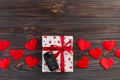 Valentine or other holiday handmade present in paper with red hearts, car keys and gifts box in holiday wrapper. box gift on Dark Royalty Free Stock Photo