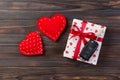 Valentine or other holiday handmade present in paper with red hearts, car keys and gifts box in holiday wrapper. box gift on Dark Royalty Free Stock Photo