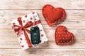 Valentine or other holiday handmade present in paper with red hearts, car keys and gifts box in holiday wrapper. box gift on Royalty Free Stock Photo