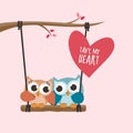 Valentine owls in love in a swing on pink background Royalty Free Stock Photo