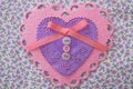 Valentine pink, purple, and white lace, doily, ribbon, and button heart Royalty Free Stock Photo