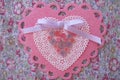 Valentine pink and white lace, doily, ribbon, and button heart Royalty Free Stock Photo