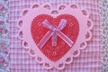 Valentine red and pink lace, doily, ribbon, and button heart Royalty Free Stock Photo
