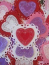 Valentine red, pink, purple, and white lace and doily hearts, vertical Royalty Free Stock Photo
