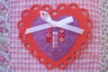 Valentine red and purple lace, doily, ribbon, and button heart Royalty Free Stock Photo