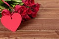 Valentine roses with gift heart shape tag Royalty Free Stock Photo