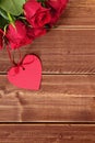 Valentine roses with gift tag, copy space Royalty Free Stock Photo