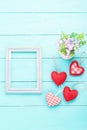 Valentine`s accessories with heart shapes on blue wooden table. Top view. Mock up for text. Mother day Royalty Free Stock Photo