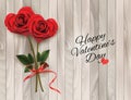 Valentine`s background with two red heart shaped roses and wooden sign.