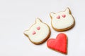 Valentine`s cookies in the form of cats and heart covered with icing