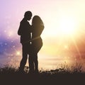 Valentine`s couple in grassy sunset landscape