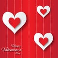 Valentine's day abstract applique background with cut red and white paper hearts.