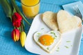 Valentine's Day abstract breakfast with egg heart and tulip Royalty Free Stock Photo