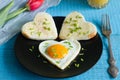 Valentine's Day abstract breakfast with egg heart and tulip Royalty Free Stock Photo