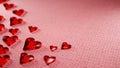 Valentine`s day, anniversary concept background. Translucent shiny red hearts on pink wool surface. Digital render