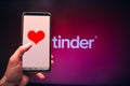 Valentine`s day, Applications for online dating, Phone in hand with a heart on the screen against