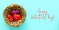 Valentine`s day background with bird nest and glitter hearts. Top view