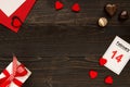 Valentine`s day background with copy space. Valentine`s Day card, gift box and chocolate on the wooden table. Royalty Free Stock Photo