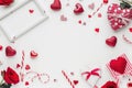 Valentine\'s day background. Frame, red hearts, confetti on white background. Flat lay, top view, copy space Royalty Free Stock Photo